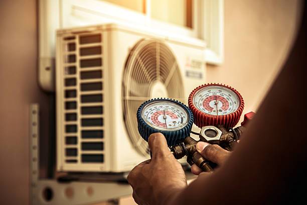 Professional Air Conditioning Service technician working in Eldridge, IA